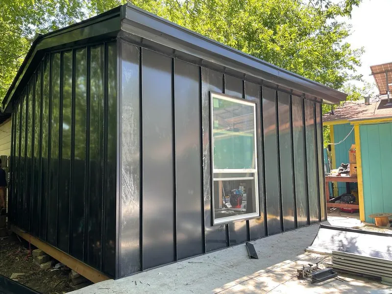 Black standing seam metal wall panels for Roof Inspection in Newstead