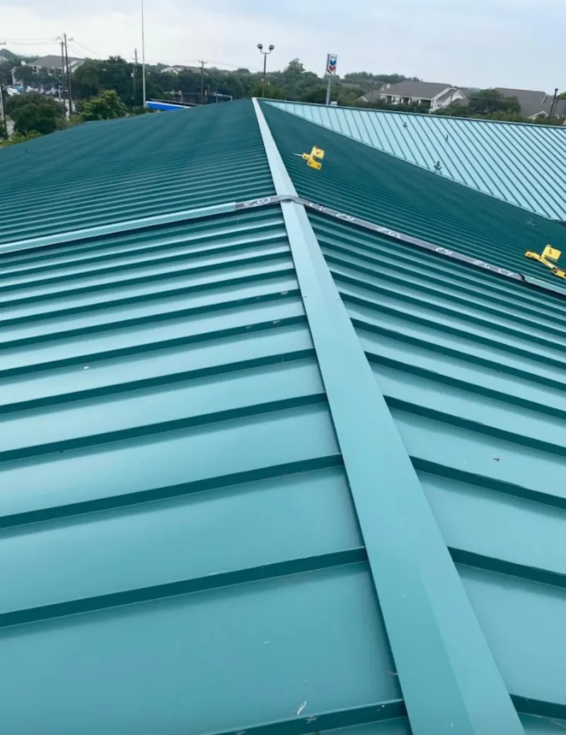 Green commercial metal roof ridge and valley for Metal Roof Repair in Newstead