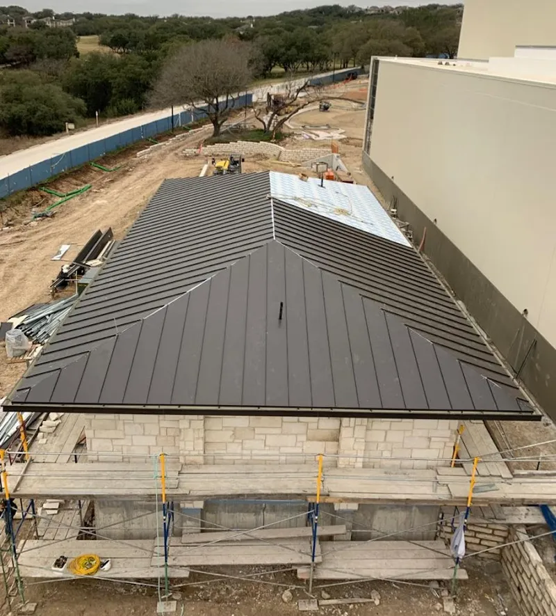 Metal roof new construction with scaffolding in Newstead